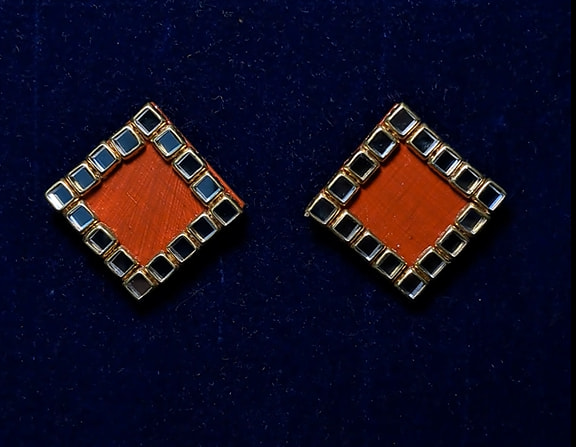 Indian red diamond stud by Velaora Jewels